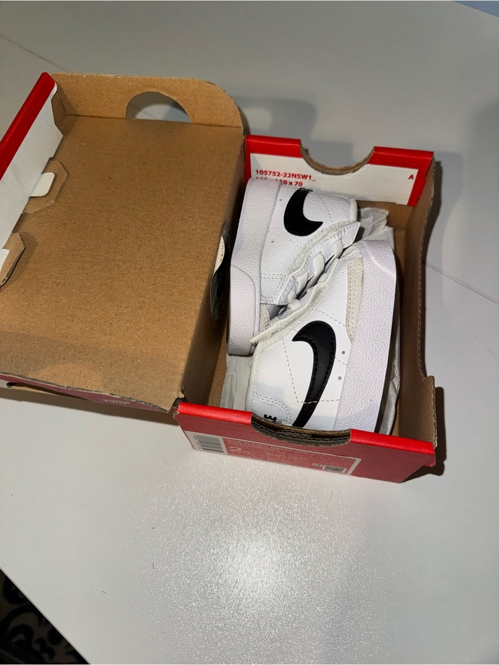 Nike White Sneakers with Black Swoosh